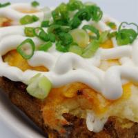 Baked Potato · Twice baked potatoe with cheese, bacon, sour cream and chives