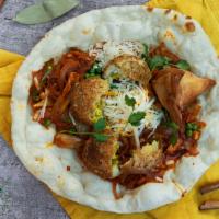 Delhi wala wrap · samosa aloo tikki and cheese with onions and tangy sauce with kachumber salad