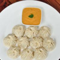 Himalayan style Chicken Momos 8 Pieces · Steamed Stuffed chicken dumpling himalayan style served with tangy herb and tomato
sauce.