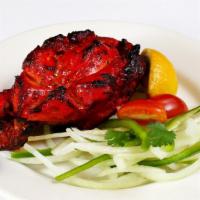 Tandoori Breast · Free range chicken marinated with yogurt and spices and cooked in charcoal tandoori
oven.