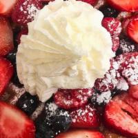Triple Berry Waffle · Topped with seasonal berries, fresh whipped cream and powdered sugar.