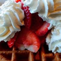 Strawberry Waffle · Topped with sliced strawberries and fresh whipped cream .
