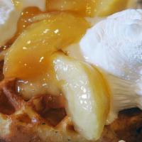 Apple Waffle · Topped with apples in hot cinnamon glaze, with fresh whipped cream