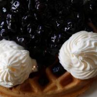 Blueberry Waffle · Topped with blueberries in a blueberry glaze, with fresh whipped cream