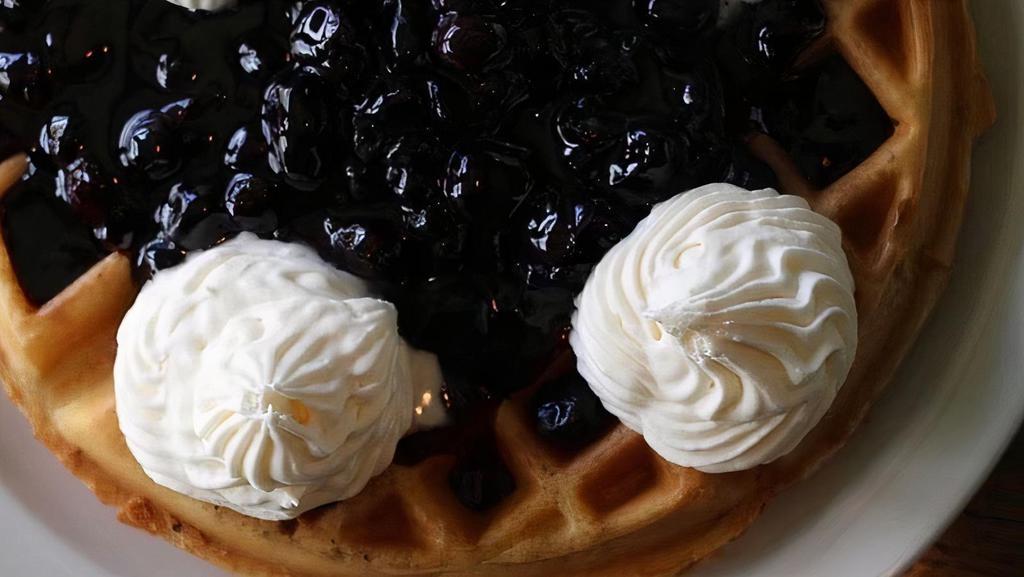 Blueberry Waffle · Topped with blueberries in a blueberry glaze with fresh whipped cream.