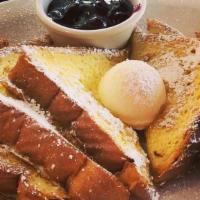 Texas Toast · 3 thick slices of dipped in an egg batter with vanilla, cream, and cinnamon. Served with you...
