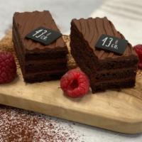 Chocolate Raspberry  Cake · Two pieces. Set of two pieces flourless French Valrhona chocolate sponge layered with raspbe...