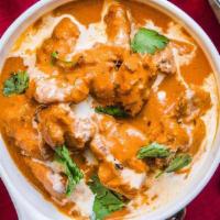 Butter Chicken · A special chicken cooked in creamy sauce made with butter, . tomatoes and onions