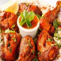 Tandoori Chicken (w/ bones) · Chicken with bones marinated in yogurt and ground. spices