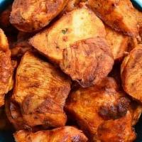 Chicken Tikka (boneless) · Tender morsel pieces of chicken breast marinated in a yogurt 
and home ground spices