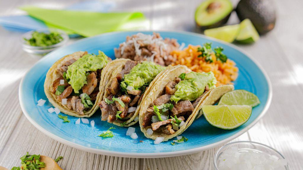 Tijuana Taco Plate · (3) Street Tacos Topped With Choice of Meat, Onion, Cilantro & Guacamole. Served with Rice & Refried Beans