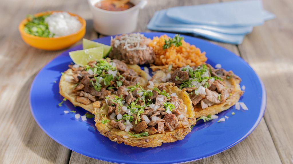 Quesi-Taco Plate · Street Taco Quesadilla with Choice of Meat, Onion & Cilantro. Served with Rice and Refried Beans