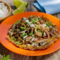 Quesi-Taco · Street Taco Quesadilla, topped with Choice of Meat, Onion & Cilantro