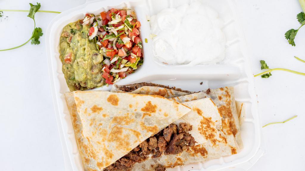 Super Quesadilla · Choice of Meat with Cheese, served with Sour Cream, Guacamole & Lettuce