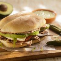 Torta · Choice of meat, topped with beans, tomatoes, onions, lettuce, avocado, queso fresco, and may...