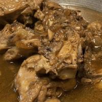 Chicken Adobo · Chicken parts simmered in soy sauce, vinegar and garlic