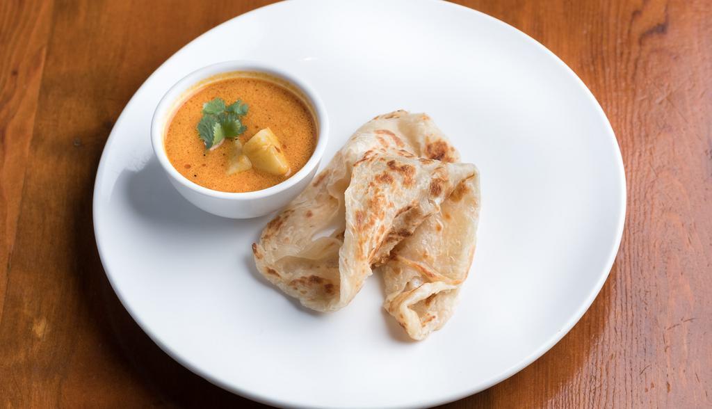 Roti Canai · indian layered flat bread served with malaysian curry and potatoes