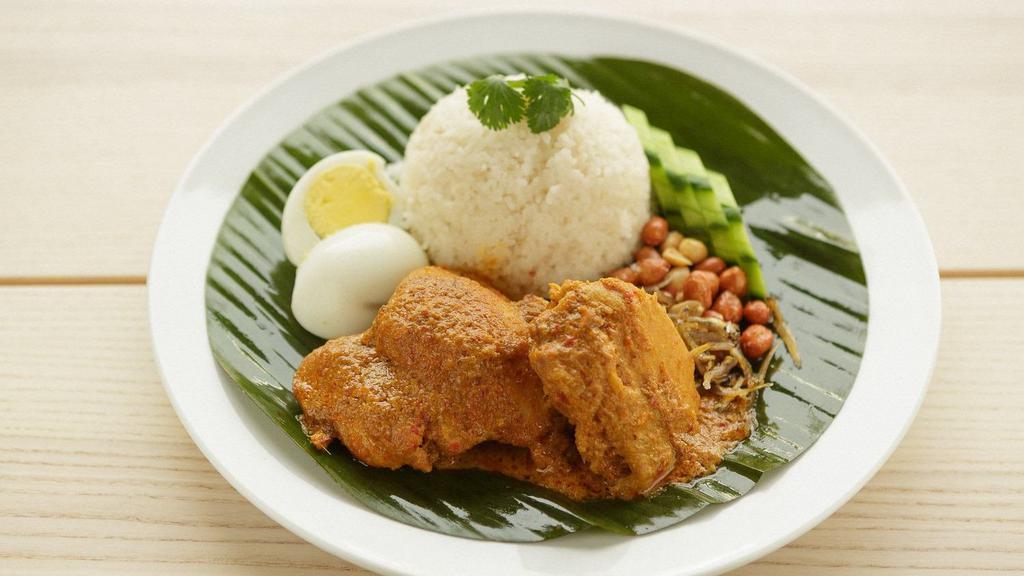 Curry Chicken · steamed rice cooked in coconut milk, served with curry chicken, sambal, fried anchovies, hard boiled egg, peanuts and cucumbers