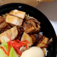 Pork Belly Rice Bowl  · Caramelized small cut pork belly served with sliced cucumber and seasoned soft boiled egg