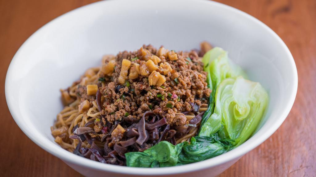 Dobanjiang Spicy Pork Noodles · hot and savory Chinese bean paste made from fermented broad beans, chili peppers served with spring onion and crispy pork lard and bok- choy