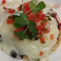 Huevos Rancheros · 2 corn tortillas with black beans, 2 over medium eggs, pico de gallo, homemade marinara sauc...
