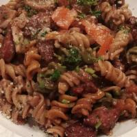 Fusilli Salsiccia · Tri-colored fusili with sautéed italian sausage, mushroom, tomato and olives on red wine sauce