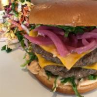 Bones Burger · Two 4-ounce beef patties, American cheese, shredded lettuce, pickled red onions, 1k island