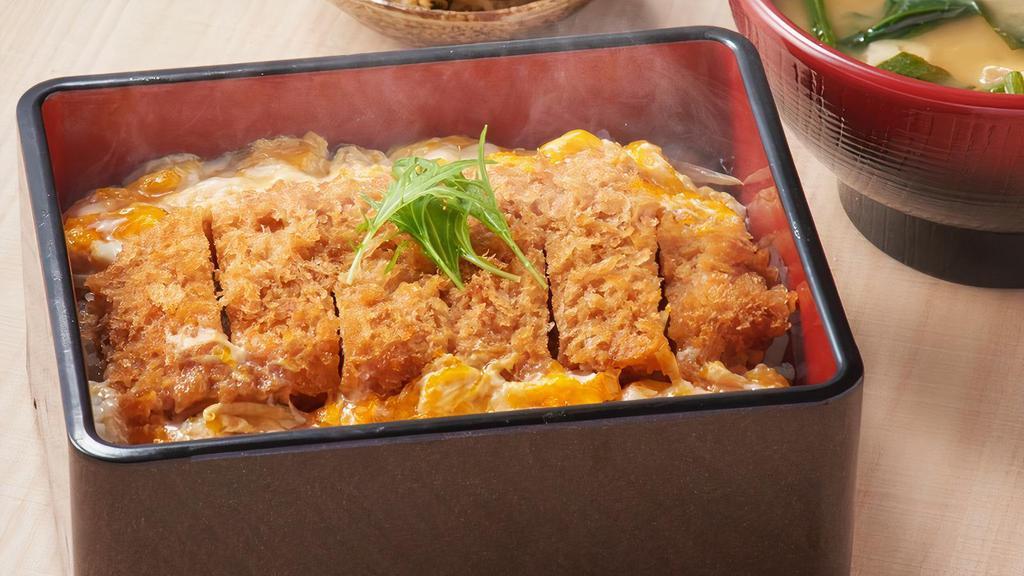947. Katsu Toji Ju · Pork cutlet simmered in sauce and eggs over rice. Miso soup.