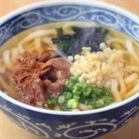 952. Niku Udon · Hot udon noodle soup topped with beef sukiyaki​