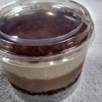 Tiramis · Coffee and zabaglione cream on a layer of sponge cake soaked in espresso. Dusted with cocoa ...