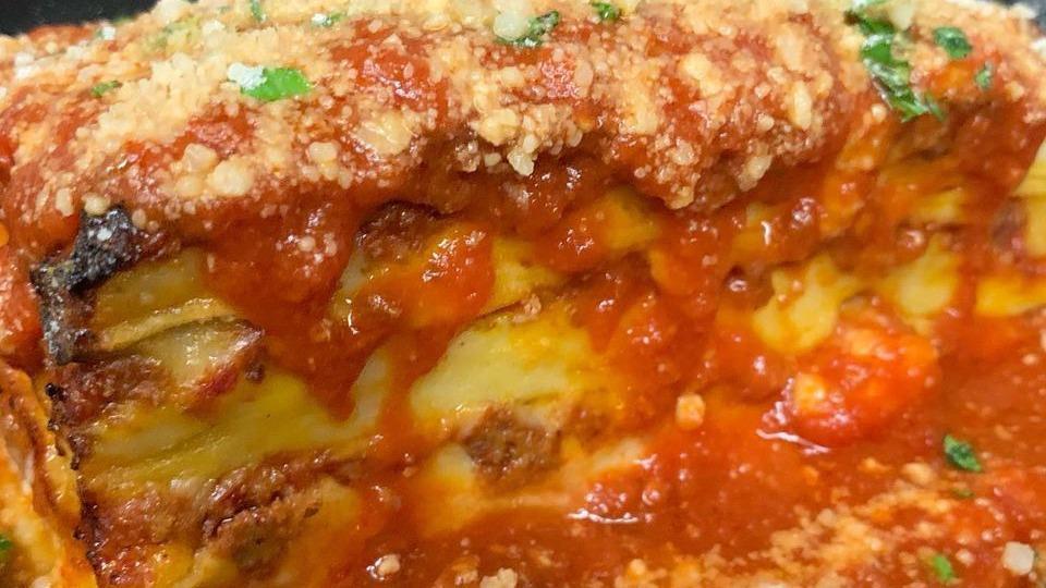 Lasagna Tradizionale · Lasagna Layered with Meat Sauce, Béchamel and Parmesan.