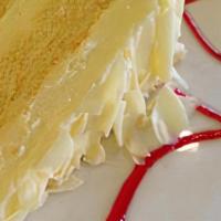 Limoncello Cake · Lemon sponge cake, lemon cream and raspberry sauce.