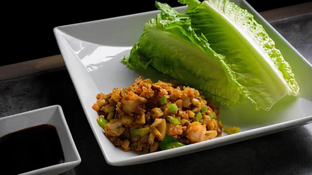 Lettuce Wrap · Lettuce wrap with radish, carrots and water chestnut with choice of chicken or shrimp, all tossed in special house sauce.