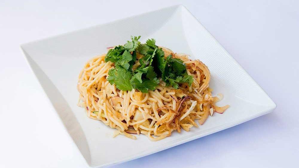 Rangoon Noodle · Egg noodles tossed with tofu, cucumbers, cilantro, tomatoes, cabbage, chili sauce, dried shrimp powder, bean sprouts, potatoes and wonton chips.