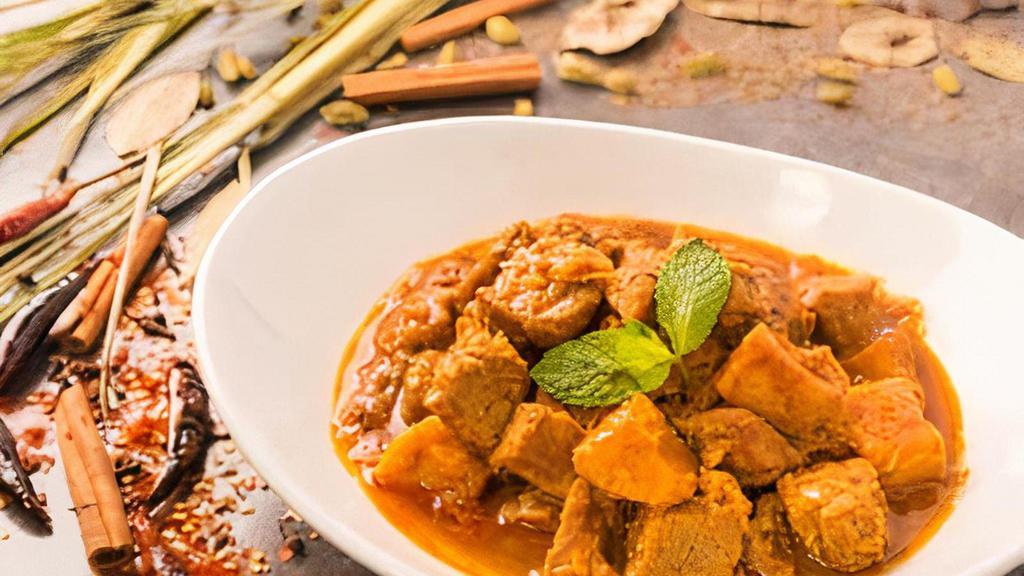 Country-Style Beef · Beef cooked in Bagan's traditional red curry with onion, garlic and red chili.