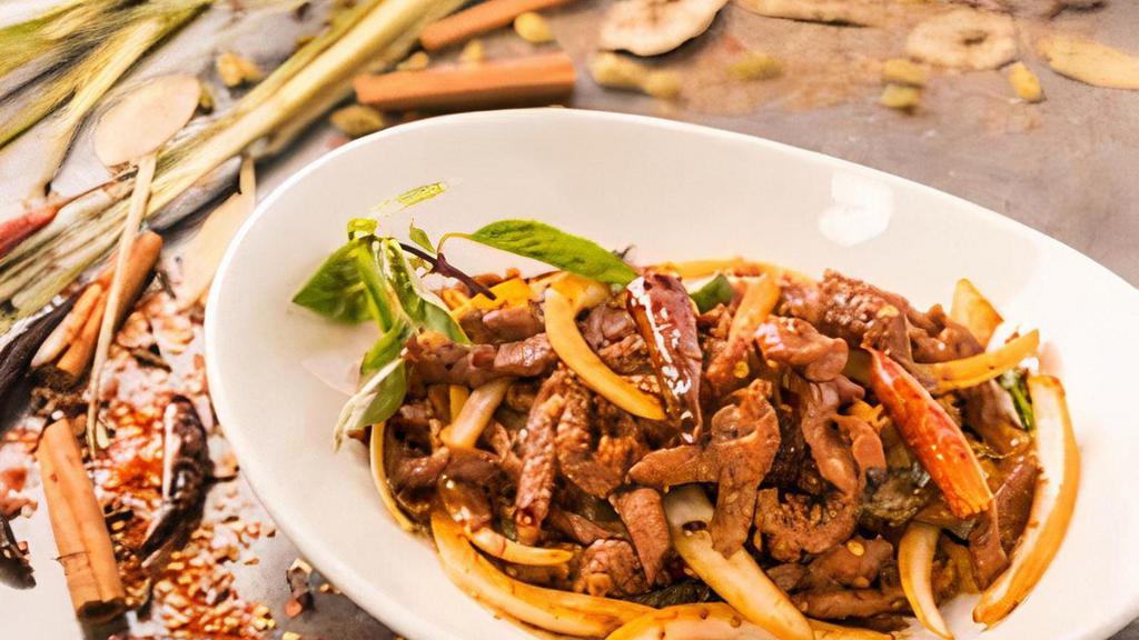 Basil Chili Lamb · Strips of lamb tossed with dried chili flakes, spices, jalapeños and onions; finished with basil.