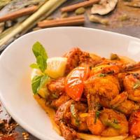 Shrimp Kebat · Marinated shrimp stir fried with paprika, masala, tamarind, green chilies, mint leaves, toma...