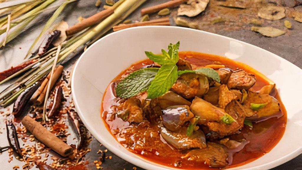 Burmese Eggplant Curry · Fried eggplant curried with onion, garlic and ginger.