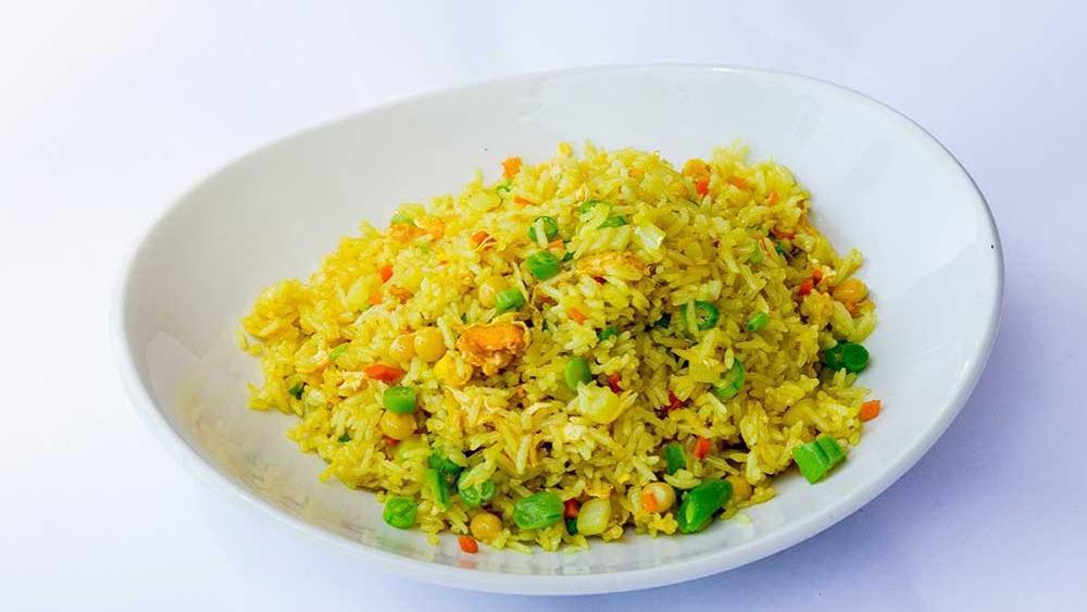 Home-Style Fried Rice Side · Tender whole yellow beans steamed with fried jasmine rice, scrambled egg and topped with fried onions.