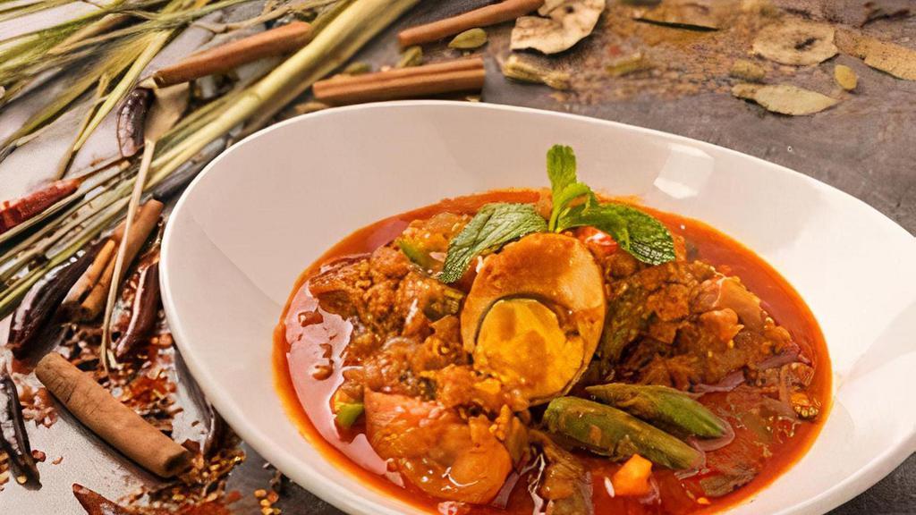 (C) Egg & Okra Curry · Red Burmese curry prepared with tomatoes, fried hard-boiled egg and okra.