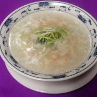 Seafood Deluxe Soup · Minced fish in a chicken broth served with a light egg white flower, ginger, cilantro and on...
