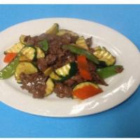 Beef in Oyster Sauce · Sliced beef sautéed with snow peas, zucchini in our chef's oyster sauce.