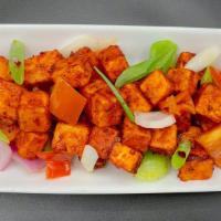 Chili Paneer · Paneer cubes marinated with Indian spices, deep fried and tossed with a spicy sauce and pepp...