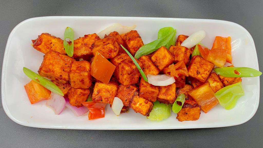 Chili Paneer · Paneer cubes marinated with Indian spices, deep fried and tossed with a spicy sauce and peppers & onions.
