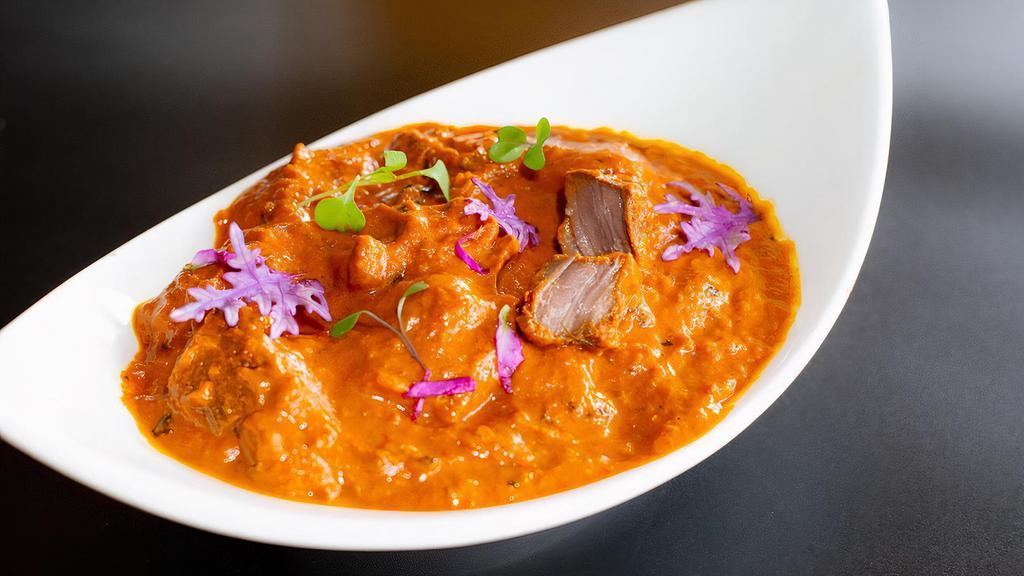 Lamb Rogan Josh Curry · Boneless Lamb chunks cooked with a gravy based on tomato, browned onions, yogurt garlic ginger and aromatic spices