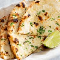 Garlic Naan · Leavened wheat flour dough flattened, topped with chopped garlic and baked in oven.