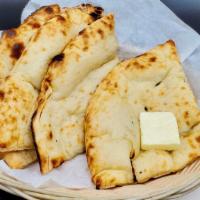 Butter Naan · Leavened wheat flour dough flattened, baked in oven and topped with butter. Allergy Indicato...
