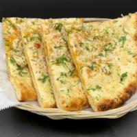 Garlic Cheese Naan · Traditional Naan stuffed with cheese and baked in clay oven