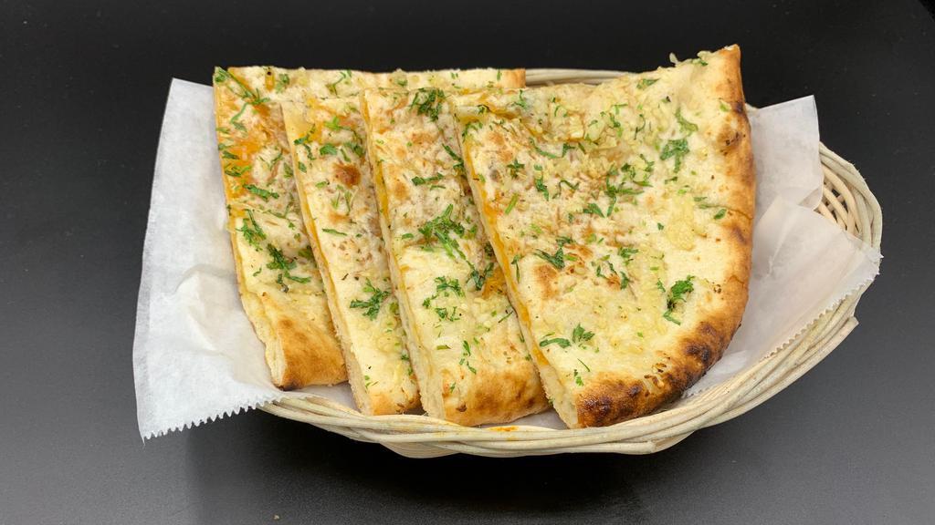 Garlic Cheese Naan · Traditional Naan stuffed with cheese and baked in clay oven