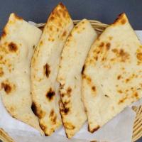  Plain Naan · Leavened wheat flour dough flattened and baked in oven.